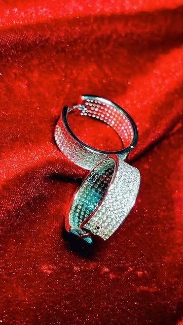 Kada set with rows of sparkling stones, on red velvet